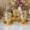 Inspire Me! Home Decor Gold Textured Metal Tea Cup And Saucer With White Interior